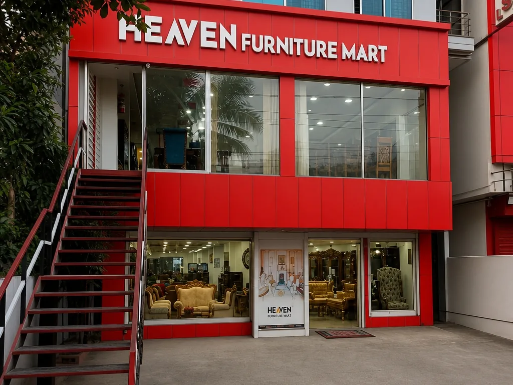 The red frontage of Heaven Furniture Mart in daylight, with its external staircase and sofas visible through the ground-floor glass